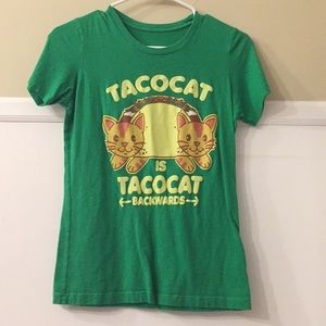 This is a green tee and says tacocat